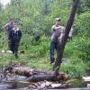08-crew member ryan tosses on another log